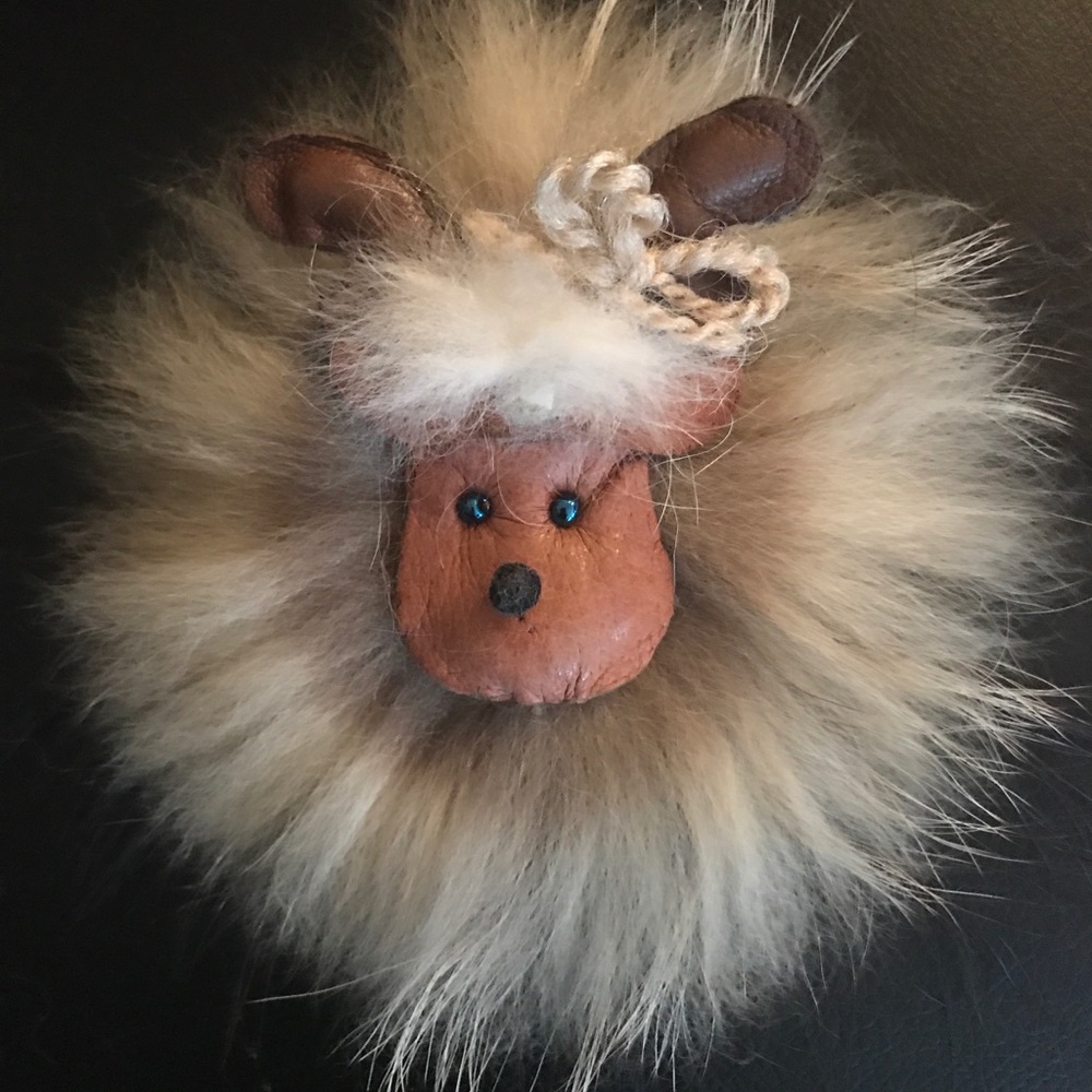 Leather and fur pin.